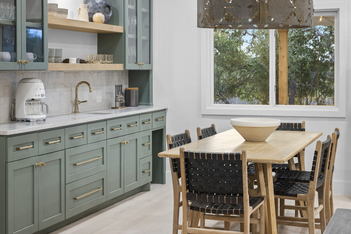 Green wooden kitchen by interior designer Molly Bowen