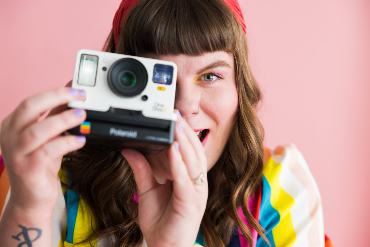 portrait of girl with her camera