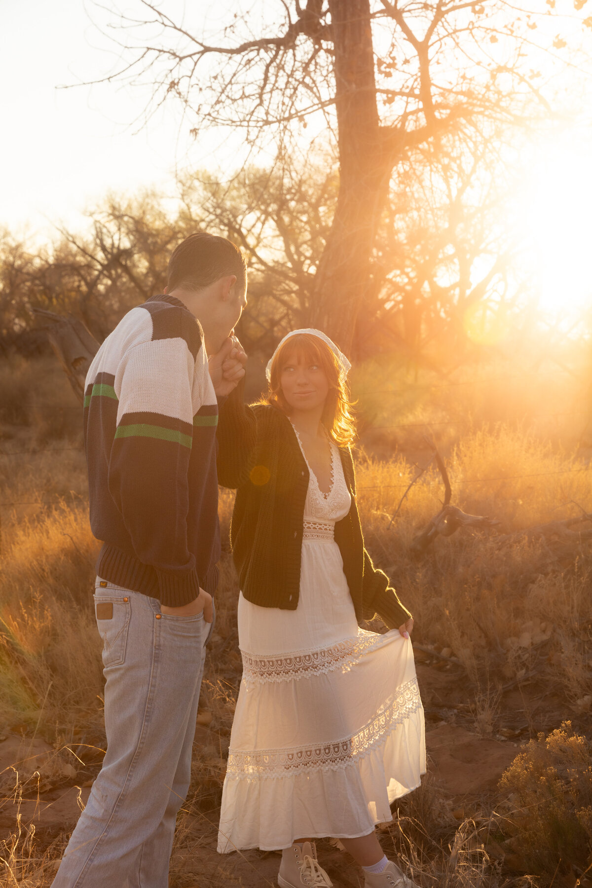 Couple embracing during sunrise in Utah, photographed by Lamblight Photography