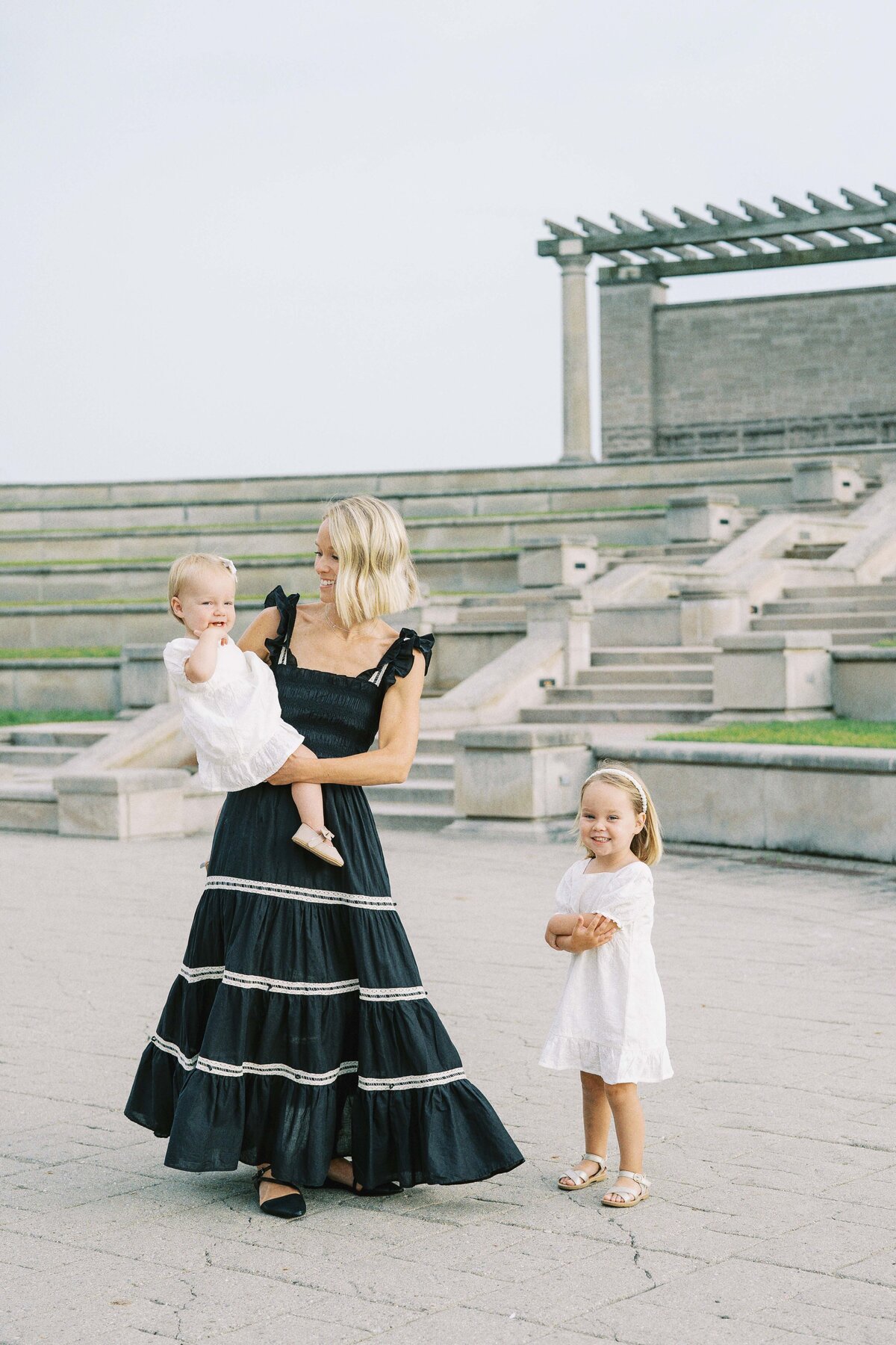 mom dancing with her two little girls
