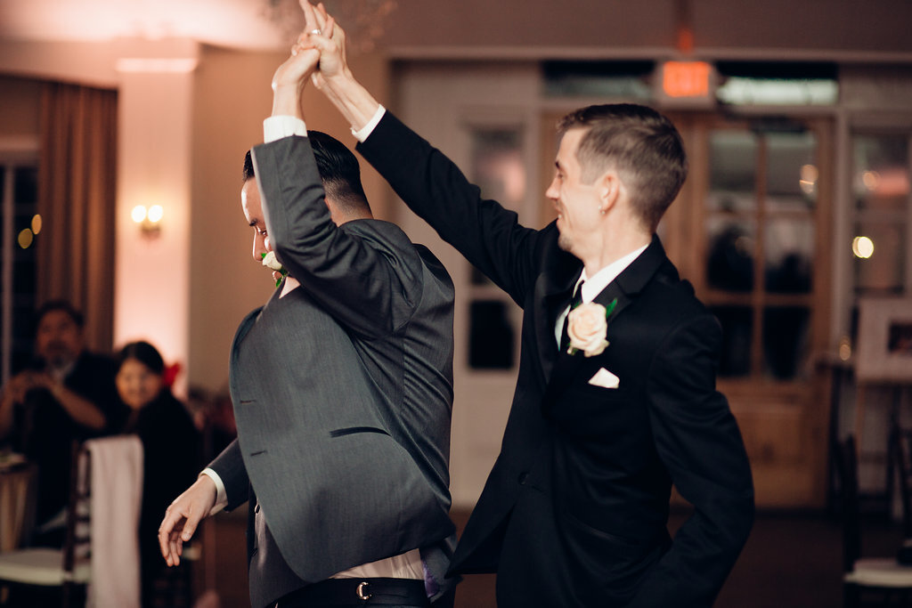 Wedding Photograph Of Groom Dancing With a Man In Gray Suit Los Angeles