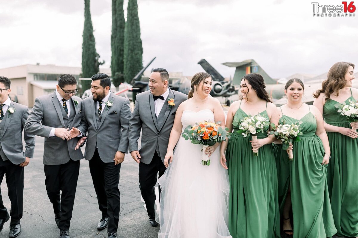 Bride and Groom walk with their Bridal Party