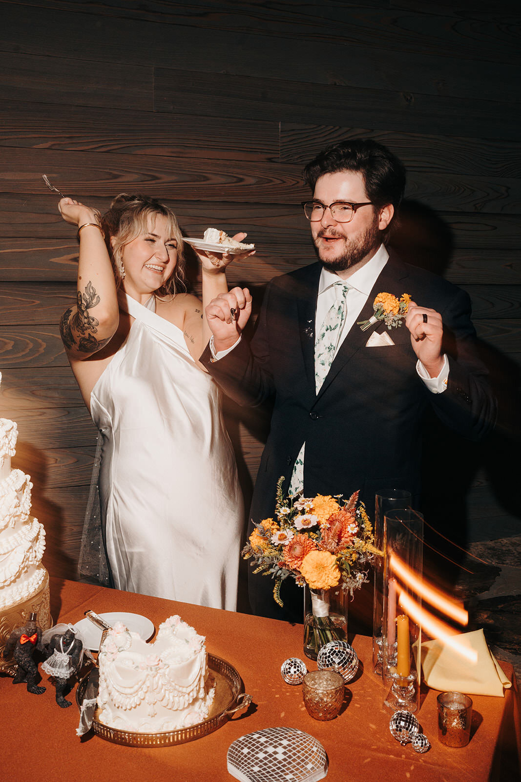 Couple eating wedding cake in Asheville, NC.
