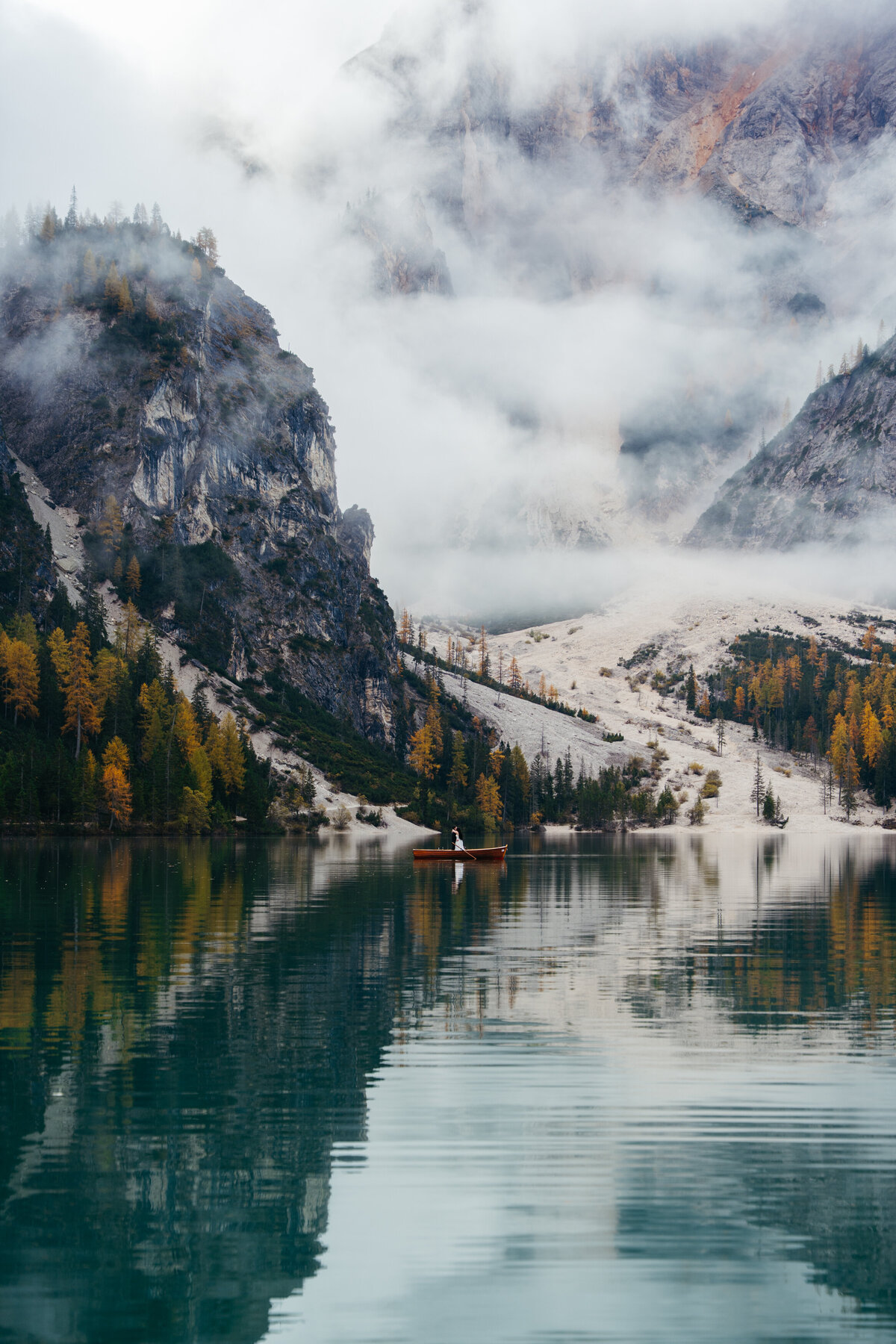 Misty mountains reflected in Lago di Braies