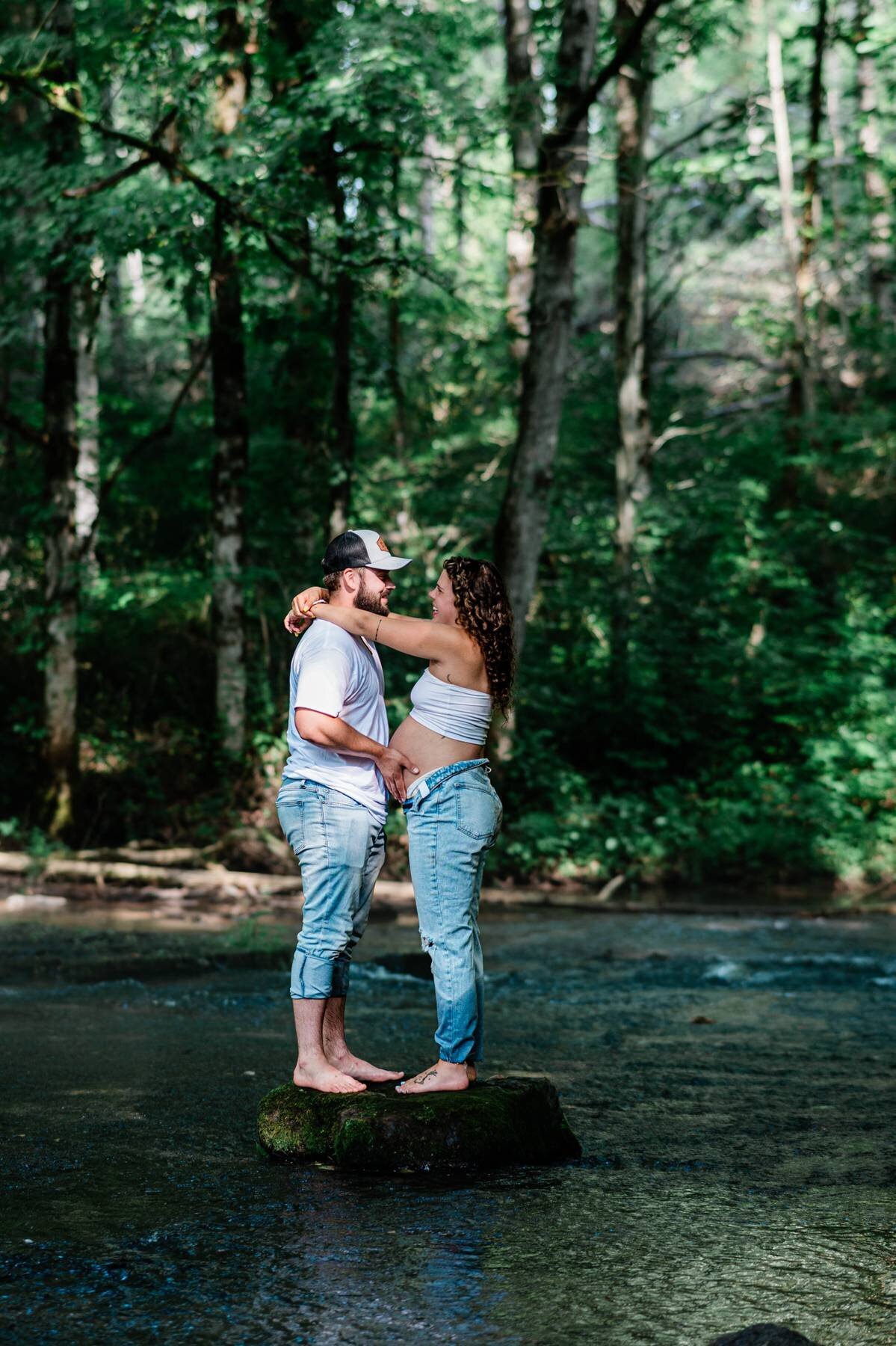 Maternity couple in a forest