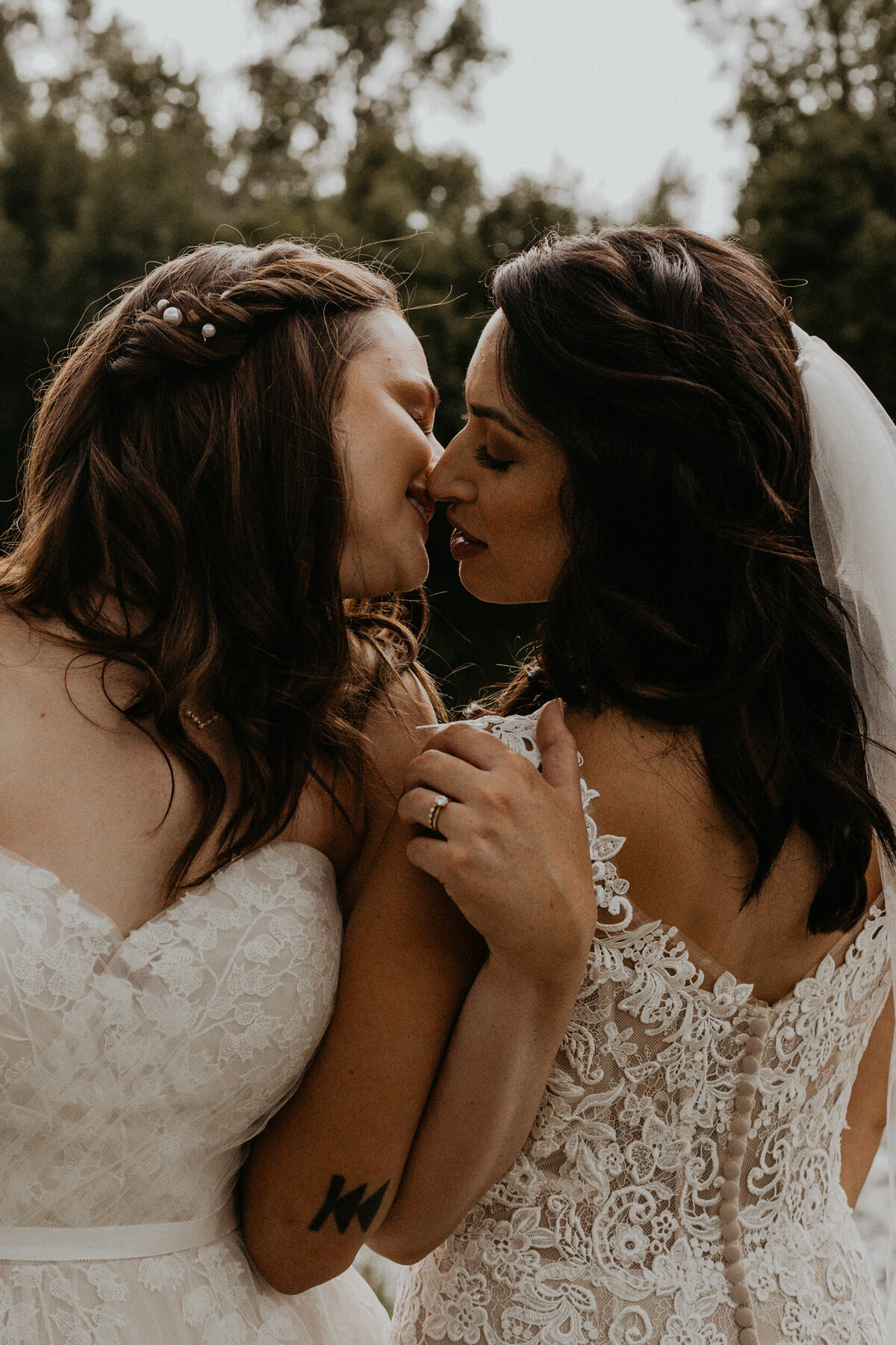 newlywed brides about to kiss