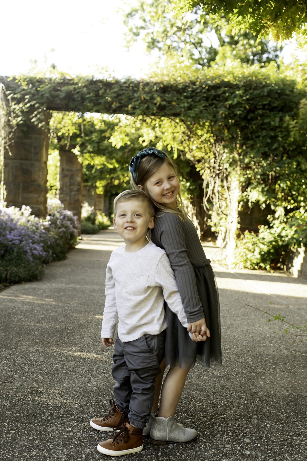 Family fun in the sun, capturing a carefree moment during their lively photoshoot