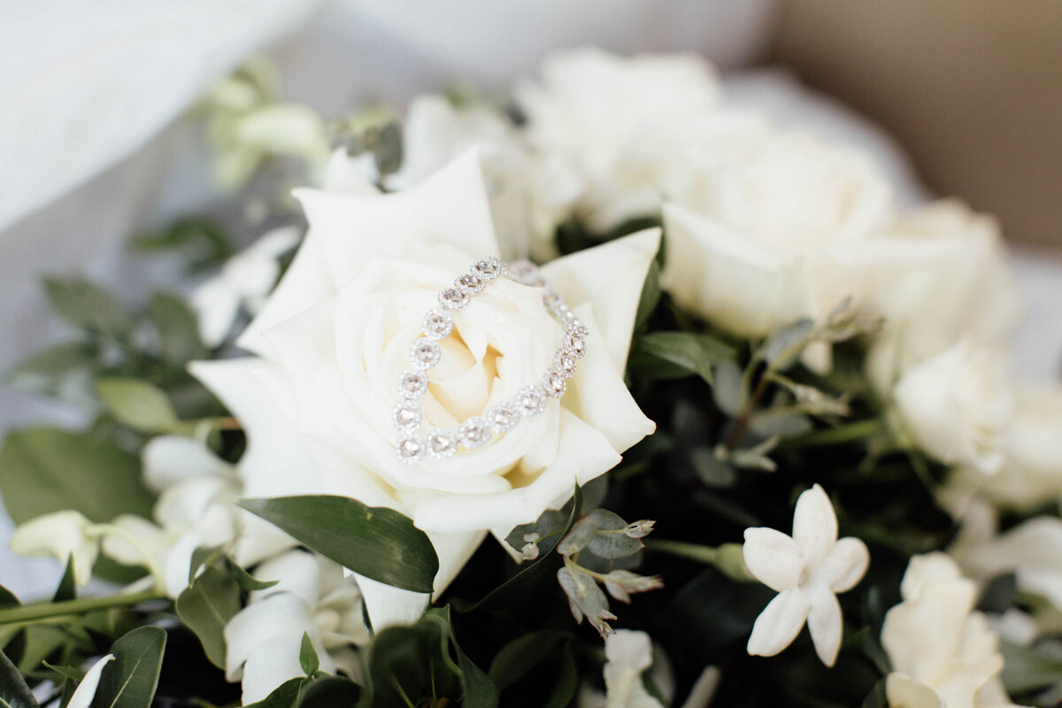Wedding bracelet on wedding bouquet.