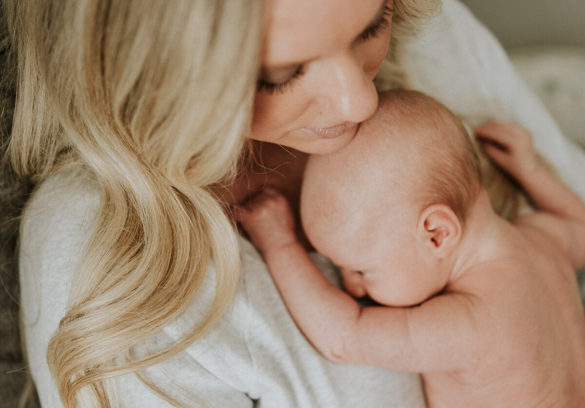 Listen to nursery whispers with in-home newborn photography in Minneapolis. Shannon Kathleen Photography captures the soft melodies of your baby's first days within the walls of your home.