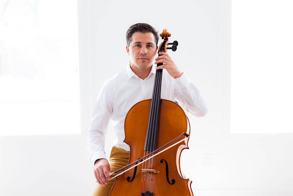 A man plays an instrument.