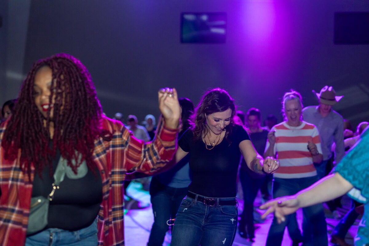 group of people line dancing