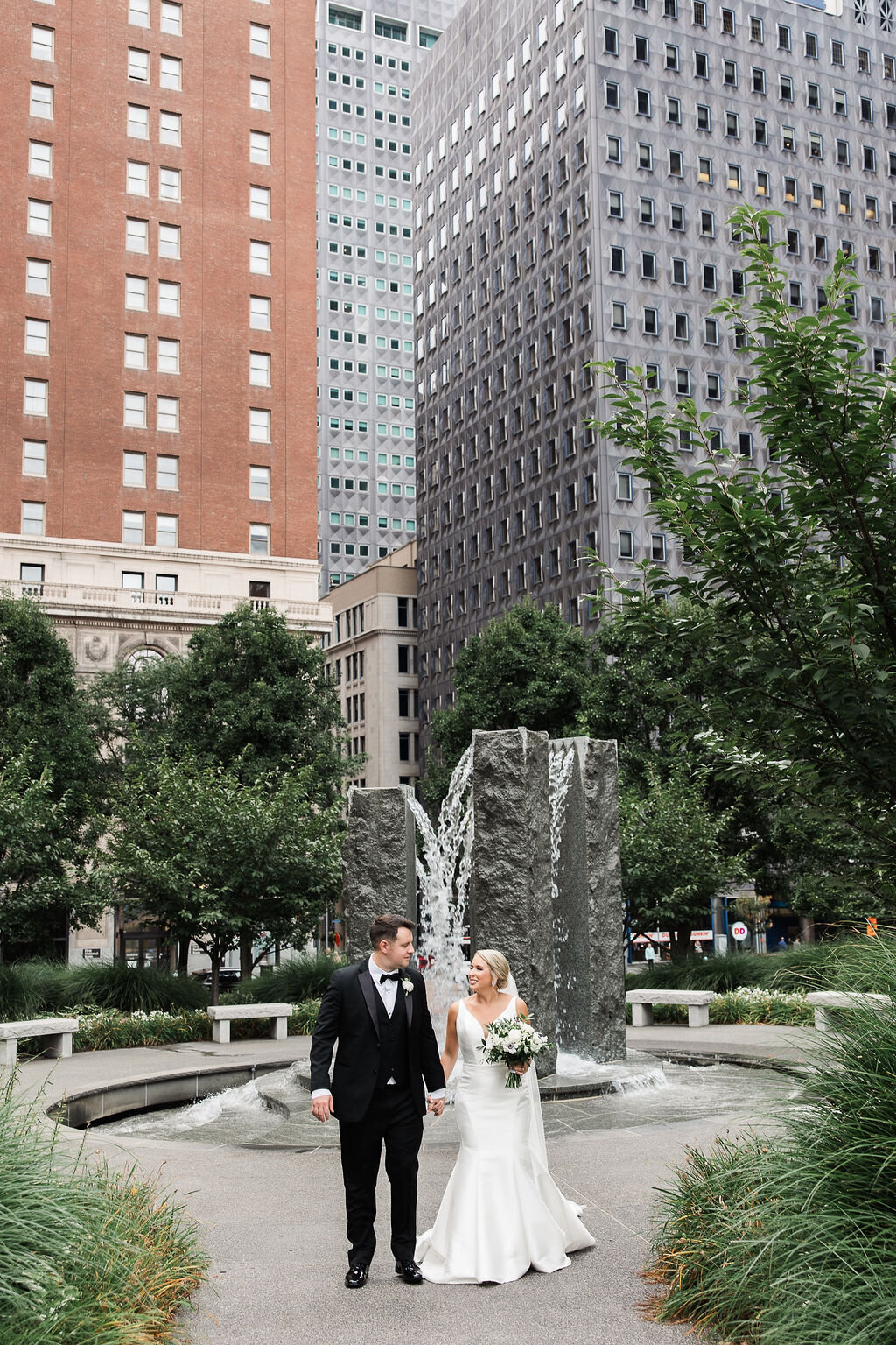 Photo of bride and groom walking hand in hand after their ceremony.