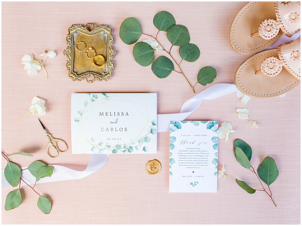 flat lay with pinks and gold and greenery