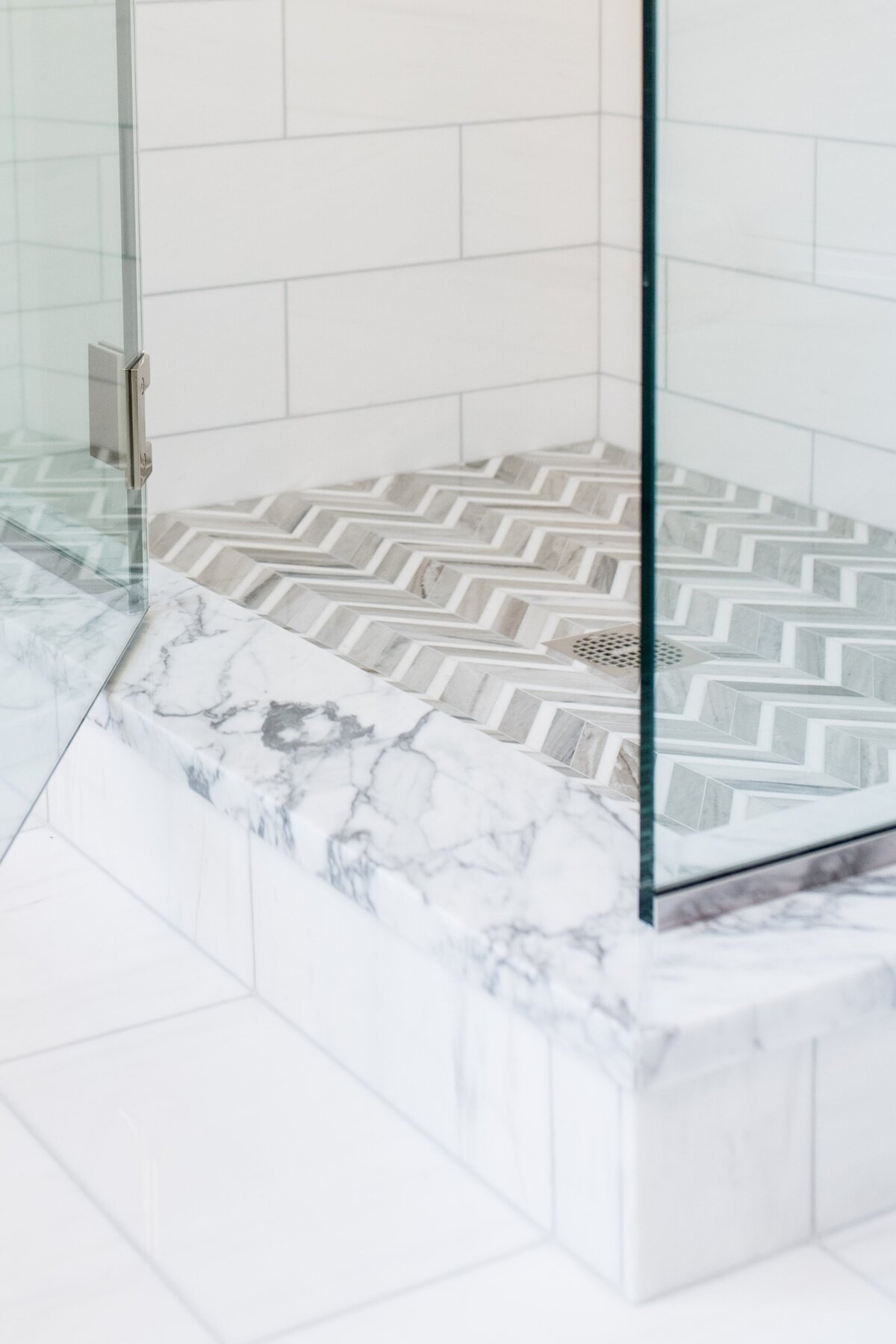 beacon-hill-marble-shower-chevron-tile-floor