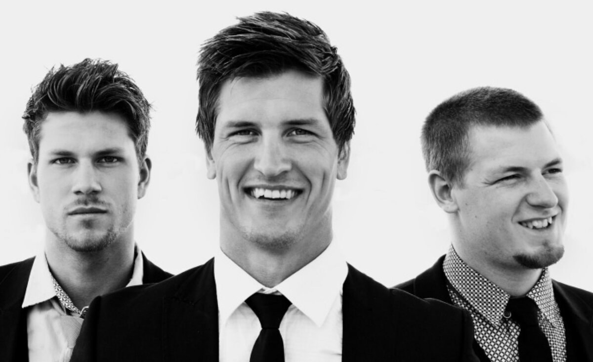 Musical trio portrait High Valley black and white close up wearing suits smiling