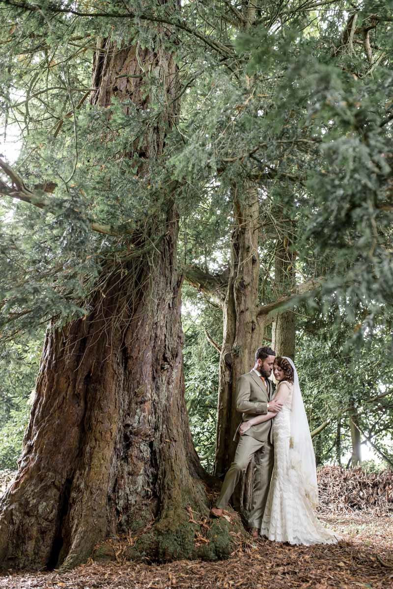 Huntsham Court wedding couple under the trees