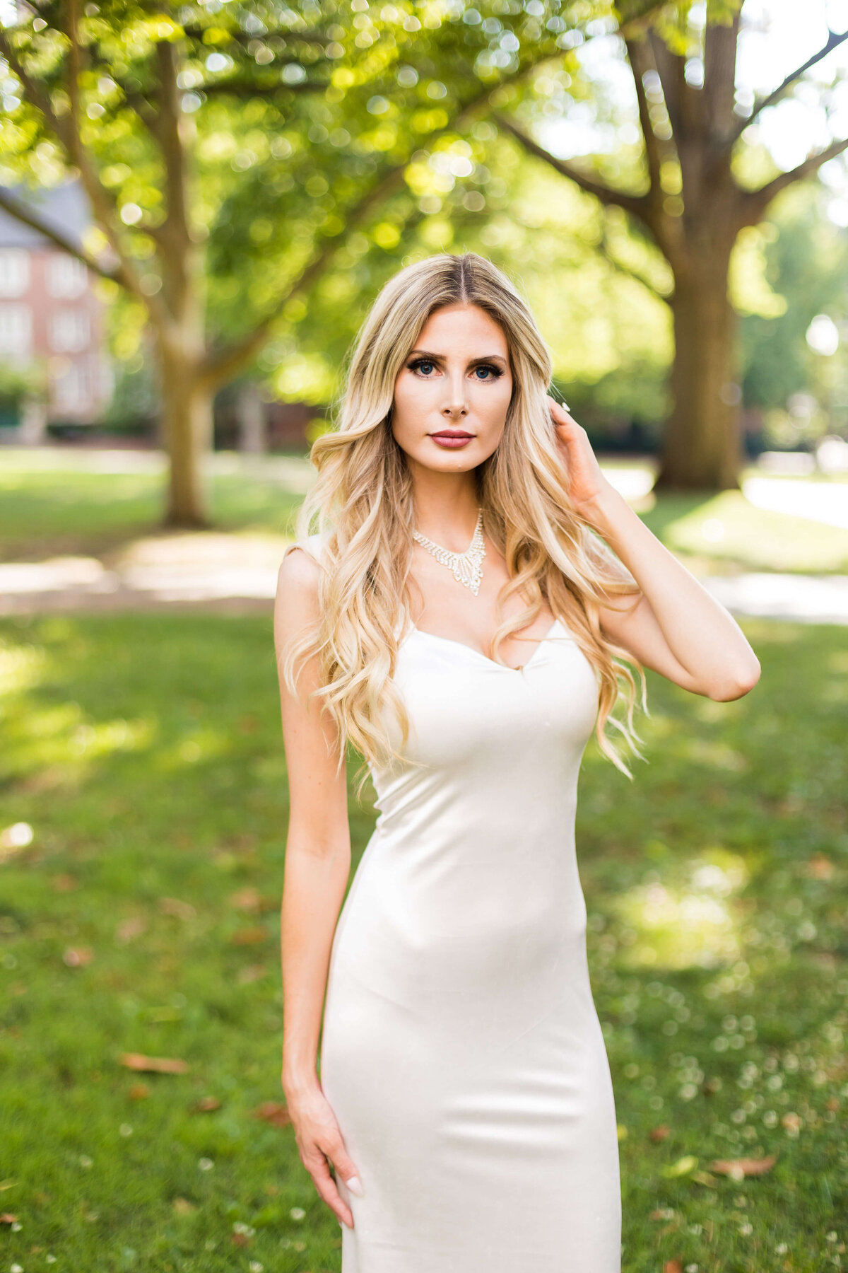 Bride wearing white fitted silk dress by Lurelly at Vanderbilt Alumni Hall, Nashille