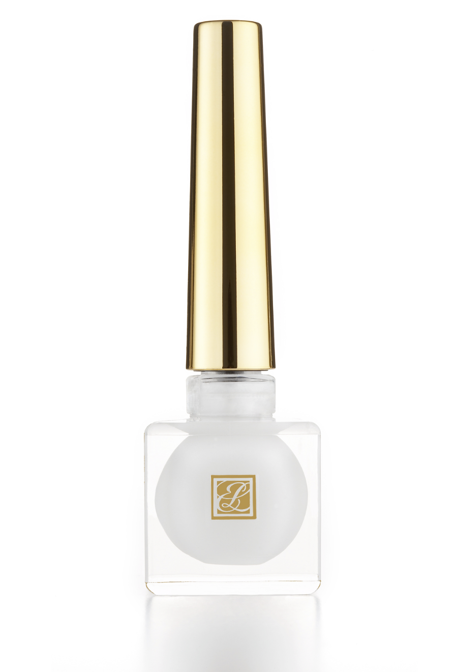 Luxurious white and gold skincare product with a sleek design, photographed by Ylva Erevall.