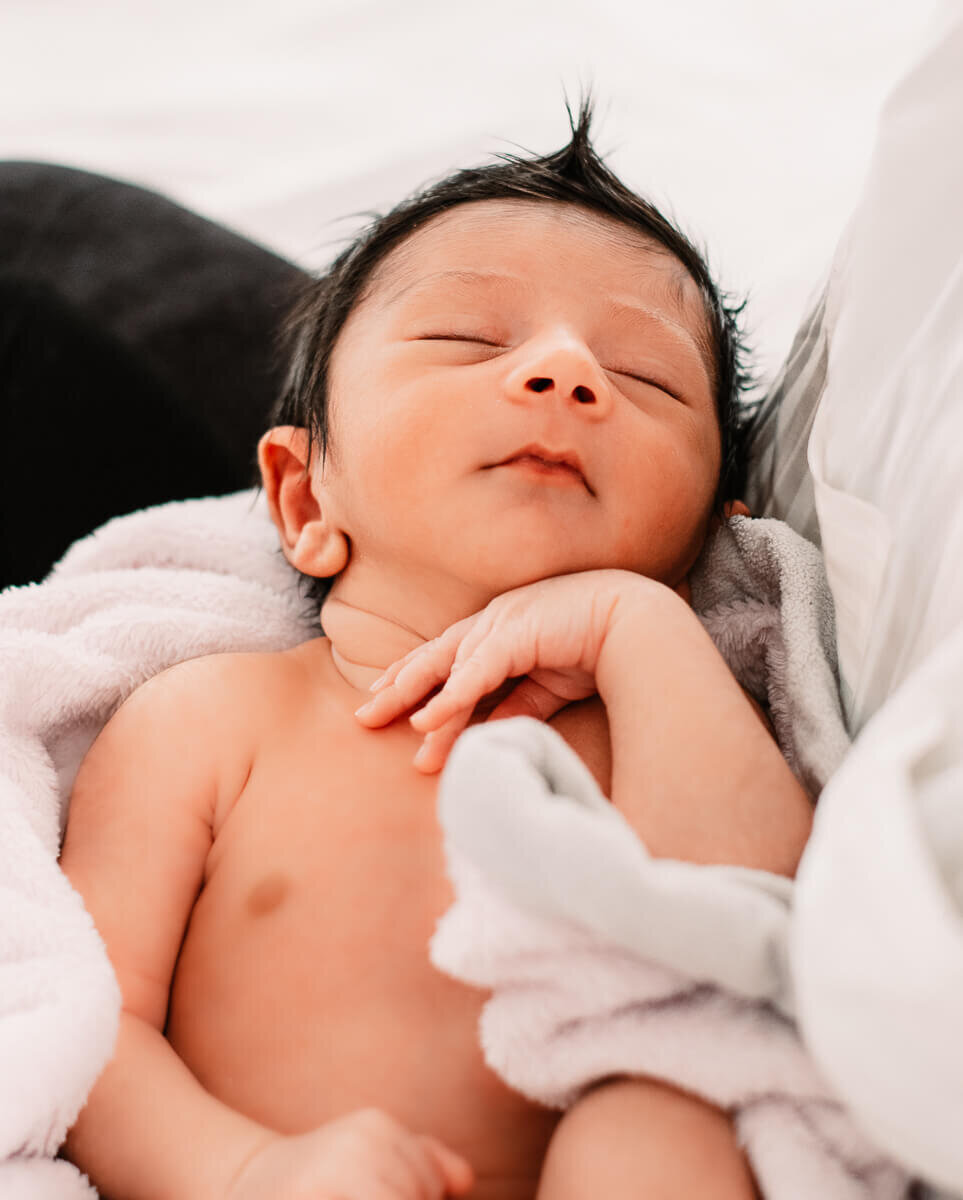 Baby boy with full head of hair in Toronto newborn photog