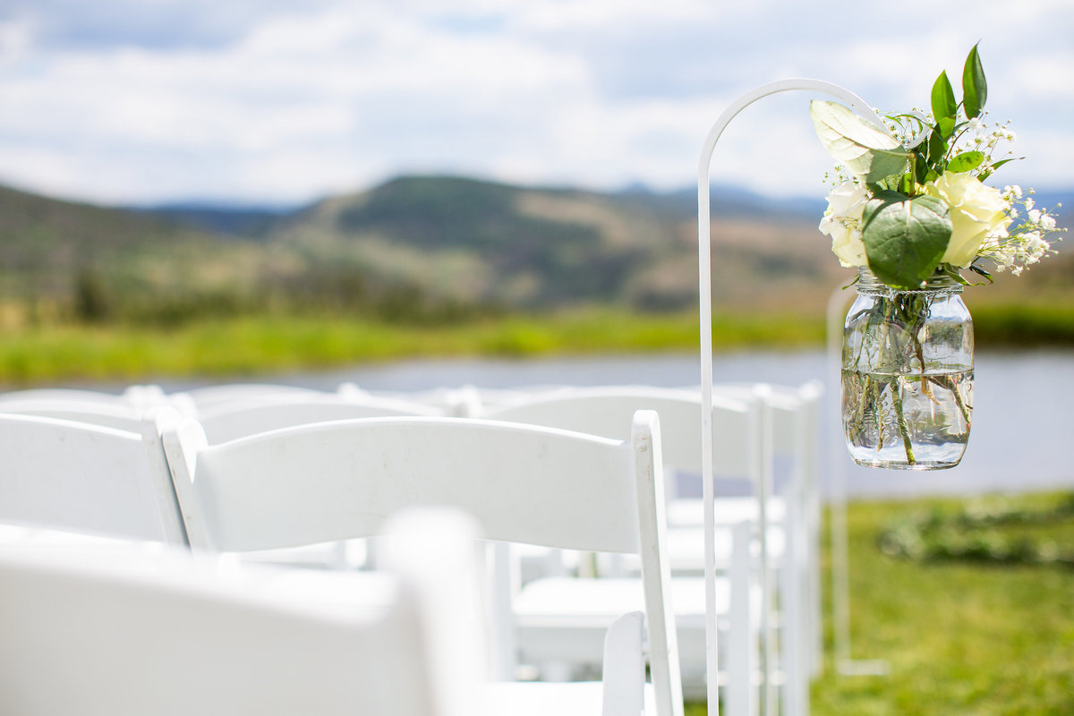 Strawberry-Creek-Ranch-Wedding-Ashley-McKenzie-Photography-Romantic-Mountain-Affair-Navy-Blush-Colorado-pews-with-flowers