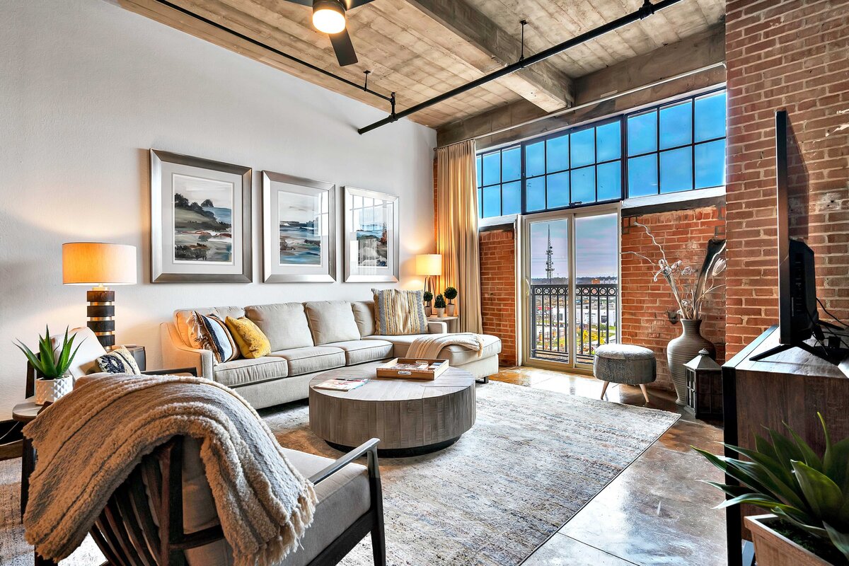 Living room in the historic Behrens building, this newly-renovated loft condo is a short walk from Magnolia Market, Spice Village, interesting shops & restaurants and about a mile Baylor’s campus in downtown Waco, TX.