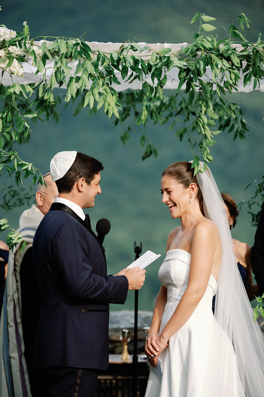 groom looks at bride at hildene wedding in manchster, vt ceremony