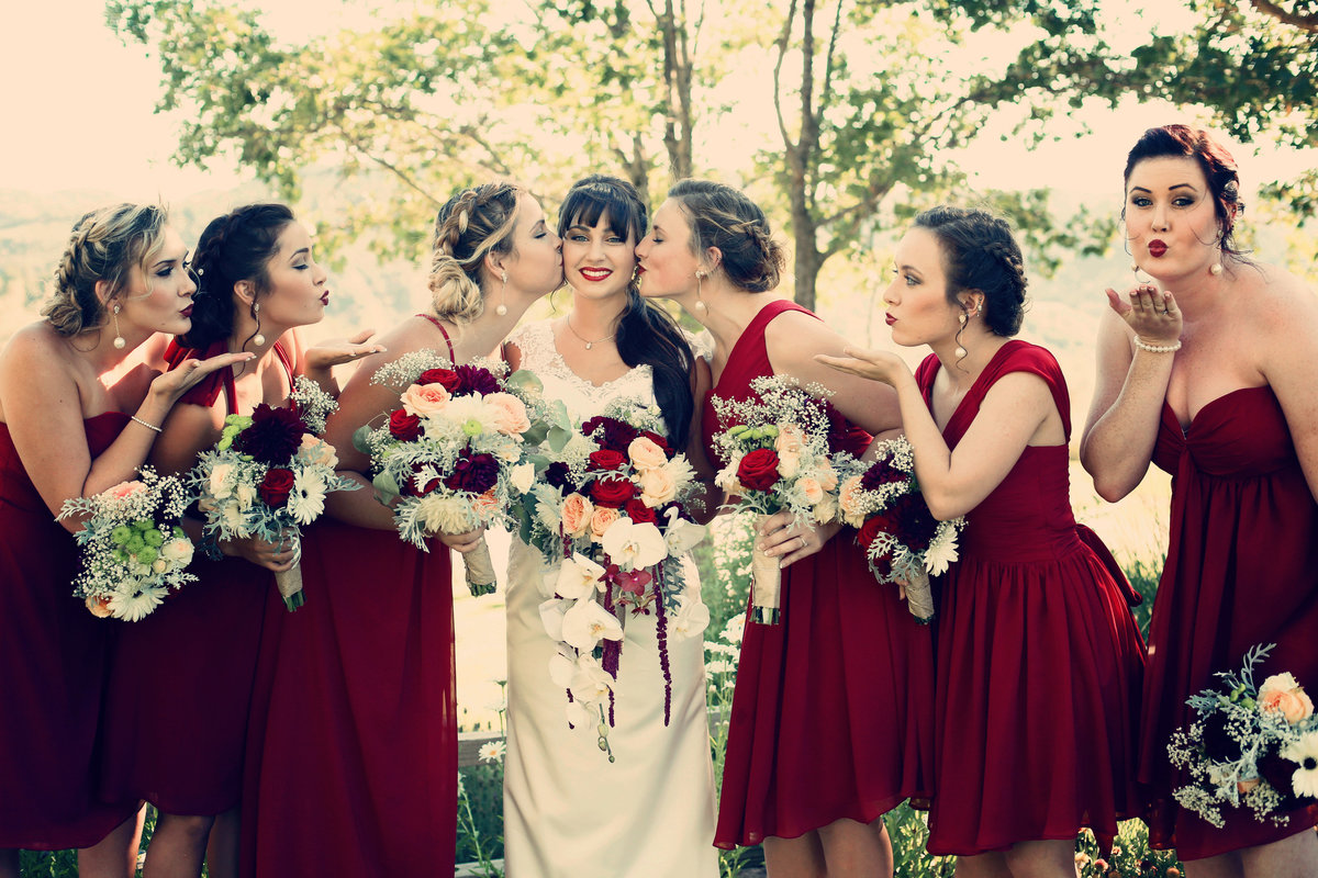 bridesmaids wearing  red dresses