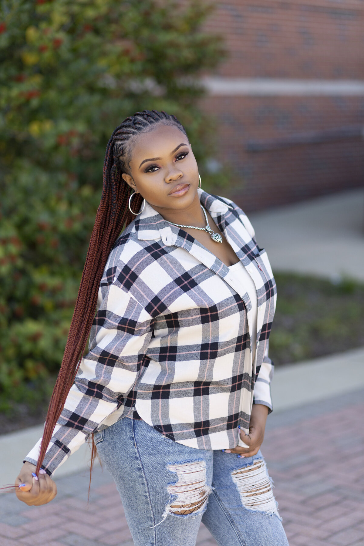 Young black teen with braids poses for her Birmingham teen  pictures.