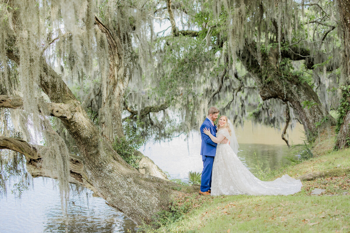 Wedding portraits on Charleston bridge with Spanish moss backdrop