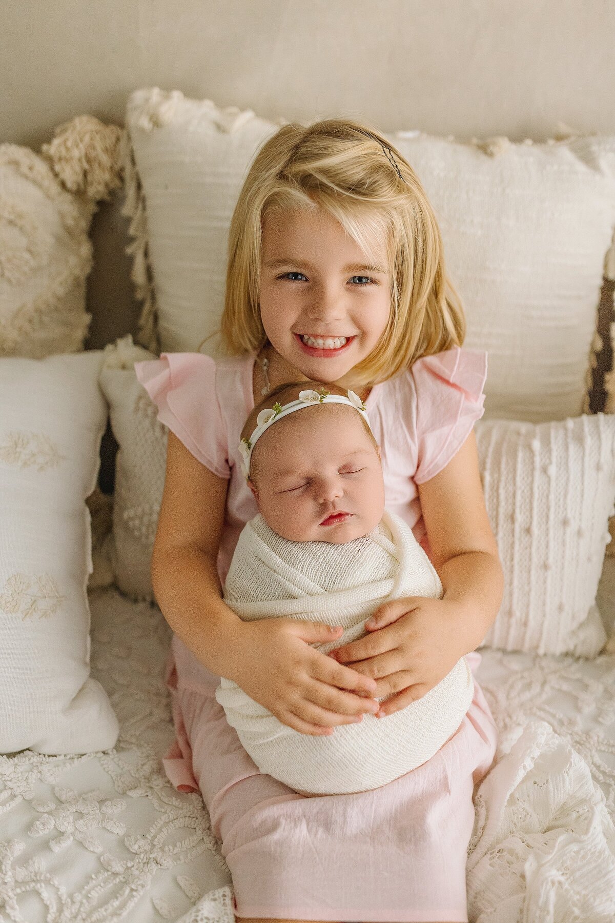 Sister with baby in studio Harrisonburg