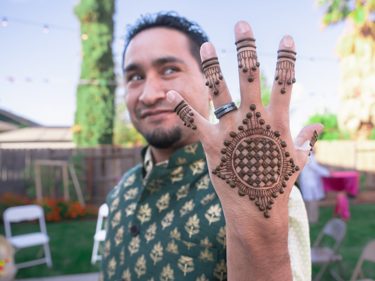 groom with henna tattoo wedding in Sacramento