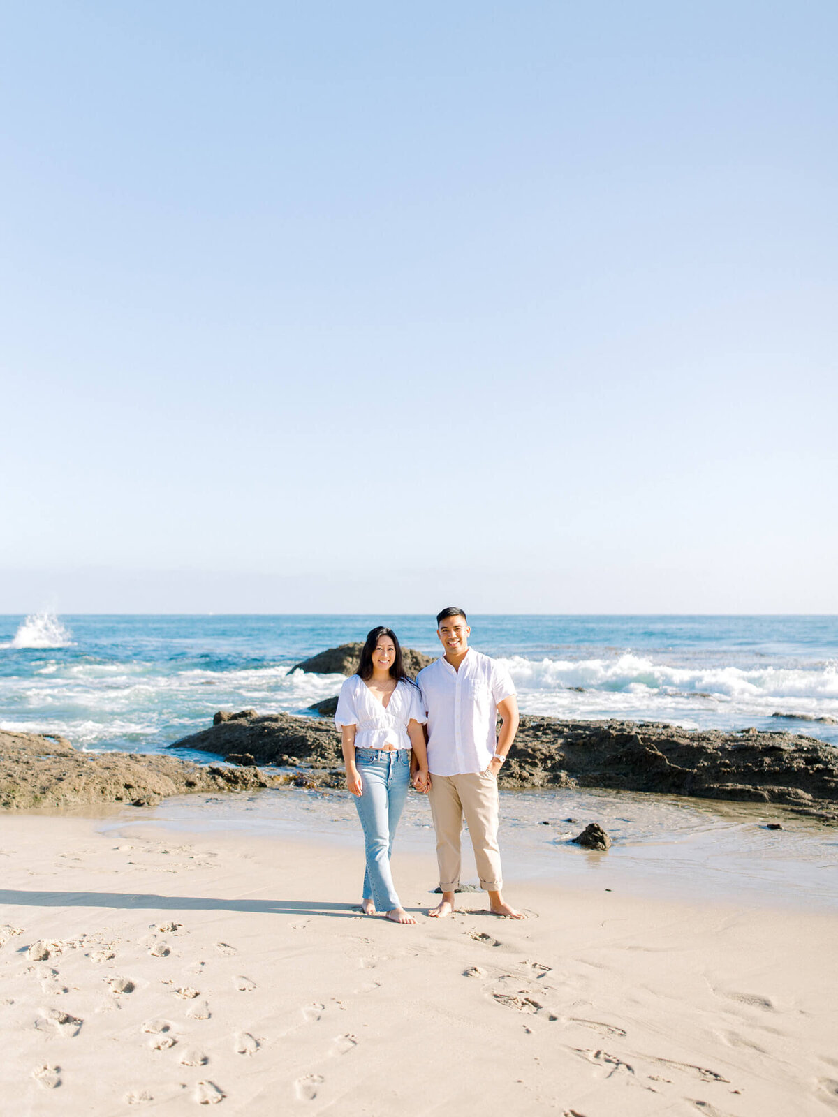 couple posing for engagement photo at laguna beach