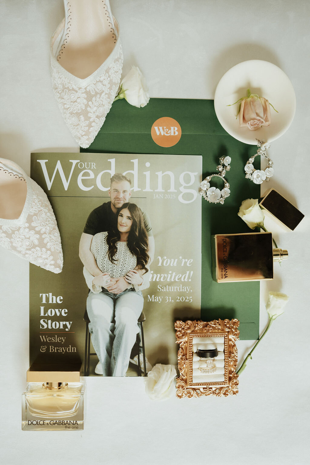 magazine wedding invitation flat lay with green envelope and monogram envelope seal