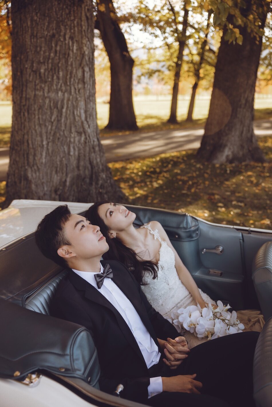Autumn wedding shoot at Millbrook, Arrowtown. Vintage car & helicopter.