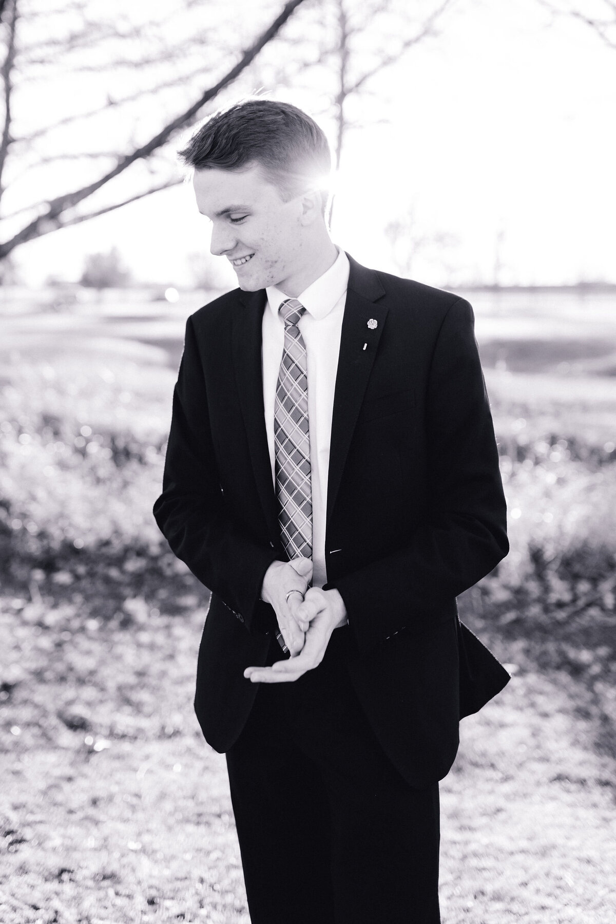 Austin senior boy in suit and tie. Outside in Austin Texas.