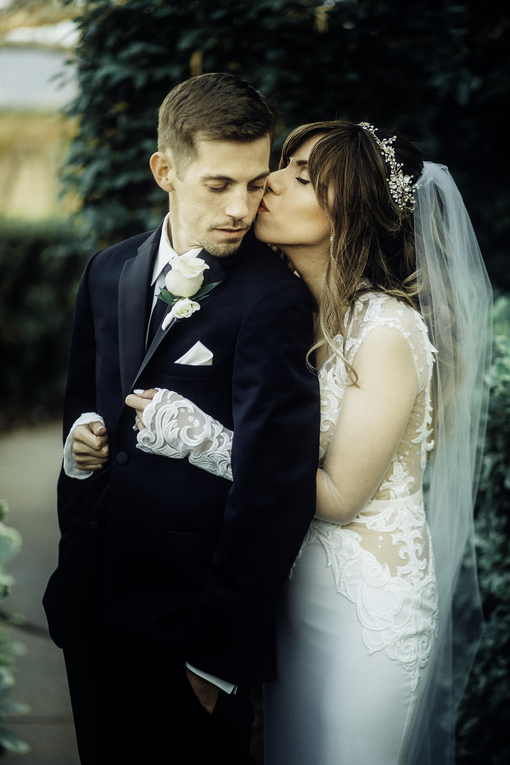 Wedding Photograph Of Bride Kissing Her Groom From The Back Los Angeles