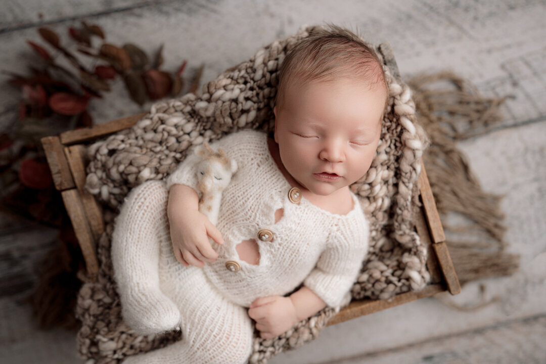 Grand Rapids Newborn Photography Baby wrapped in Knitted outfit in Box by For the Love of Photography