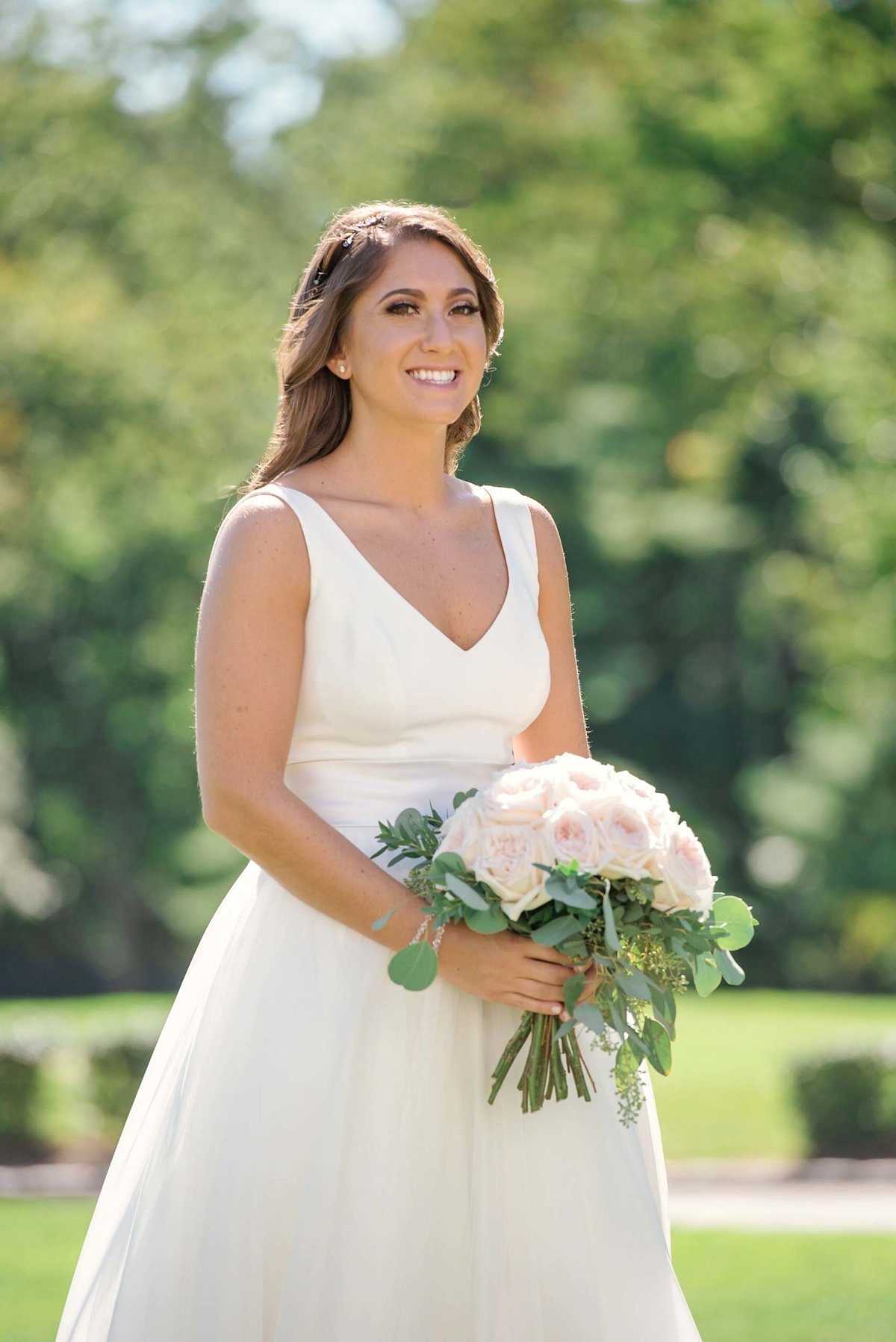 Bride outside with bouquet at Stonebridge Country Club