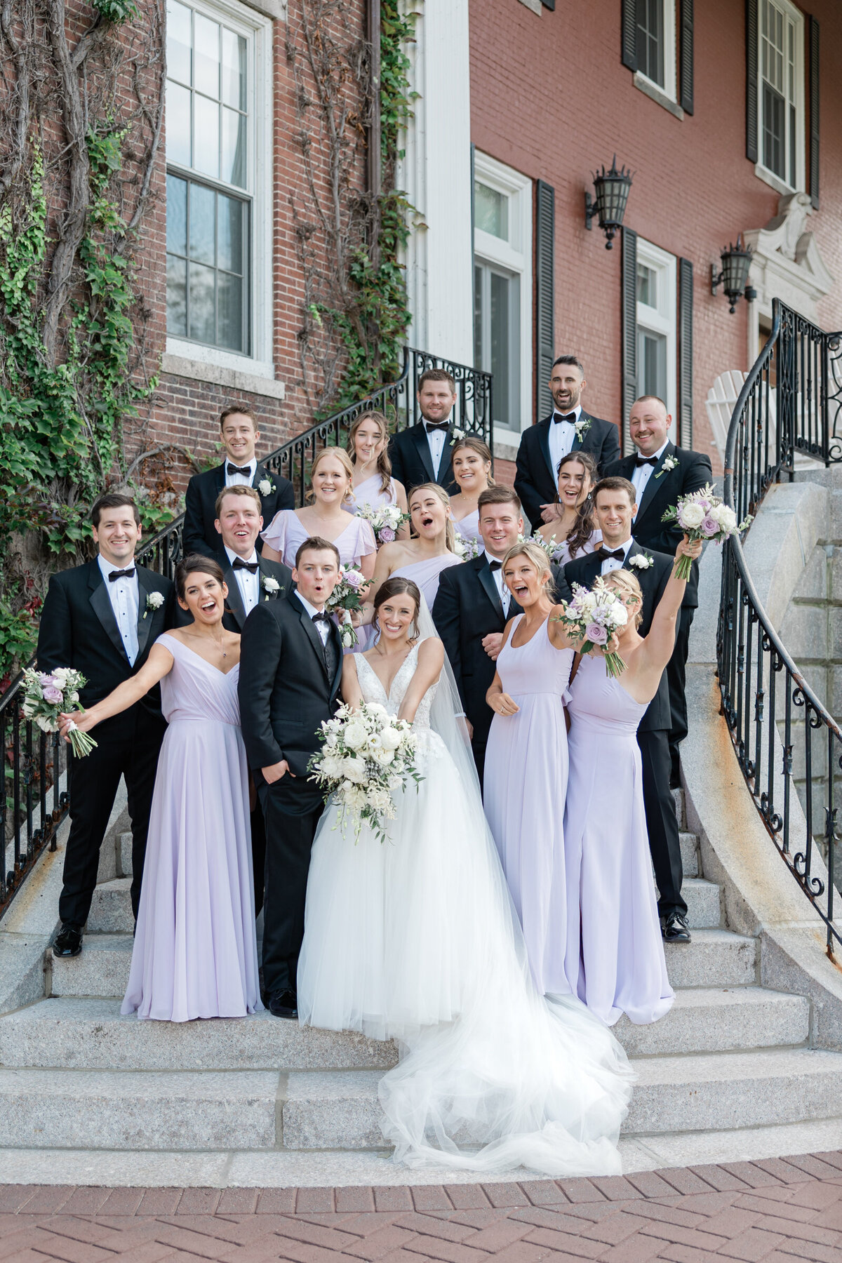 A wedding party celebrating in their black tie attire