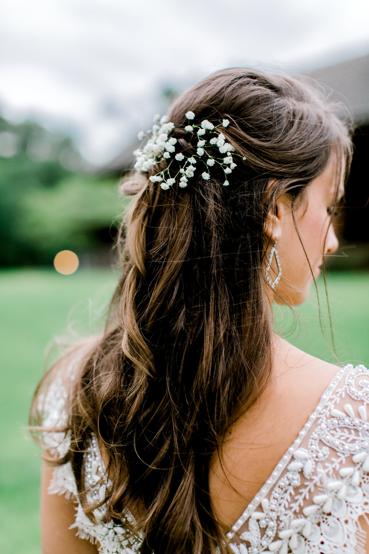 Photograph highlighting the bride's simple yet elegant hairstyle, complementing her overall bridal look with grace and sophistication.