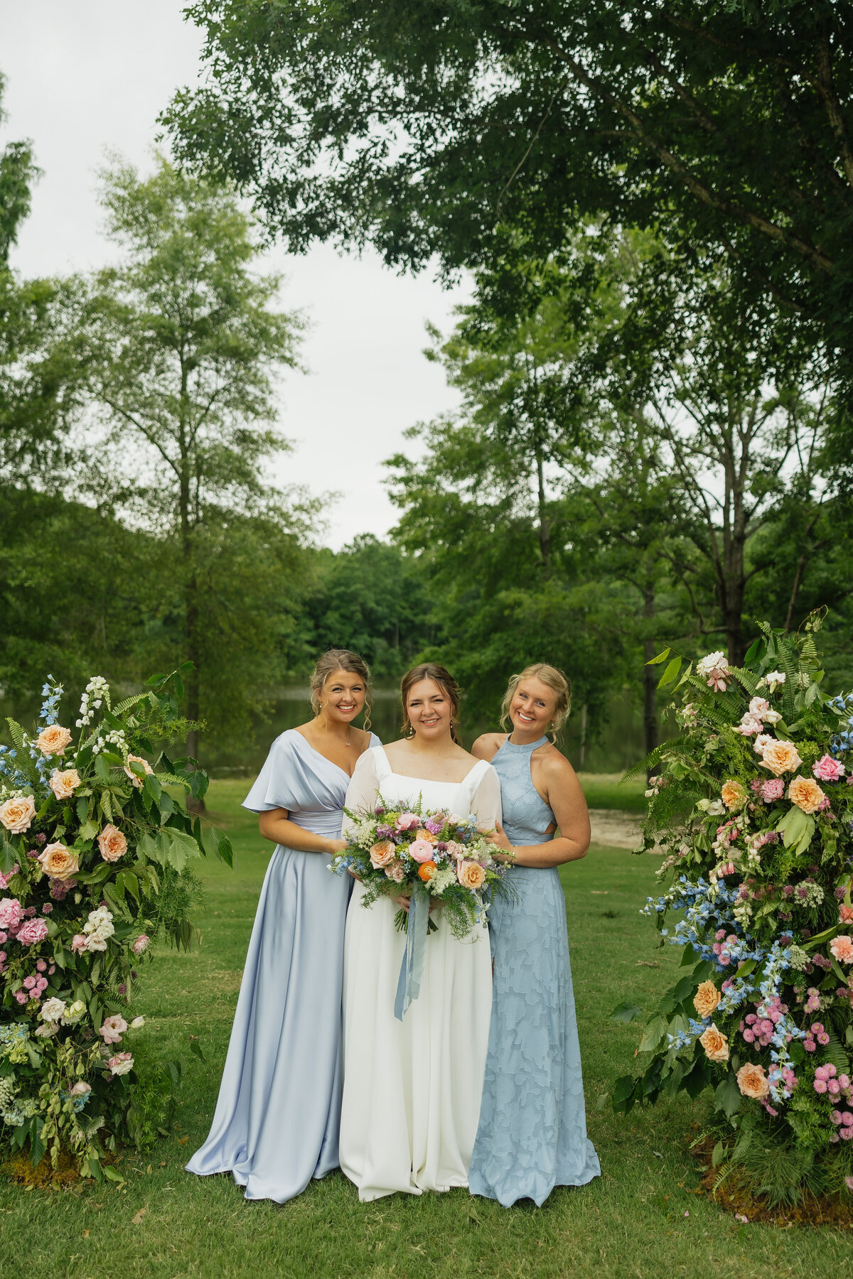 Bride and bridesmaids with colorful bouquets designed by Abby Grace Florals at Dahlonega GA wedding