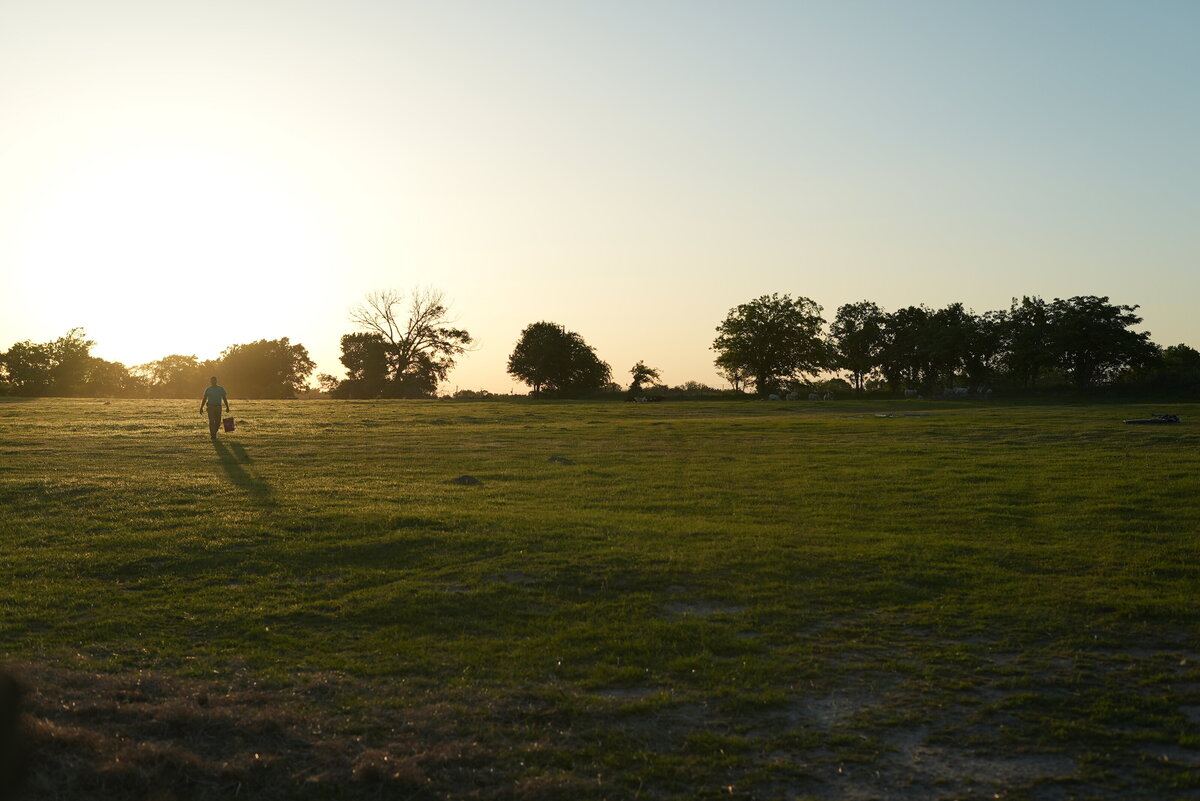 Farmer walks across his field  as his story unfolds.