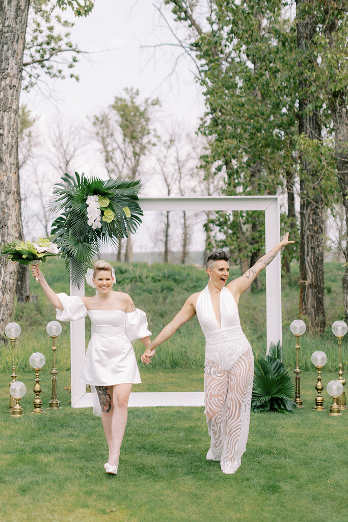 Same sex wedding ceremony at Sugar Pine Island, a romantic wedding venue in Foothills, Alberta, featured on the Brontë Bride Vendor Guide.