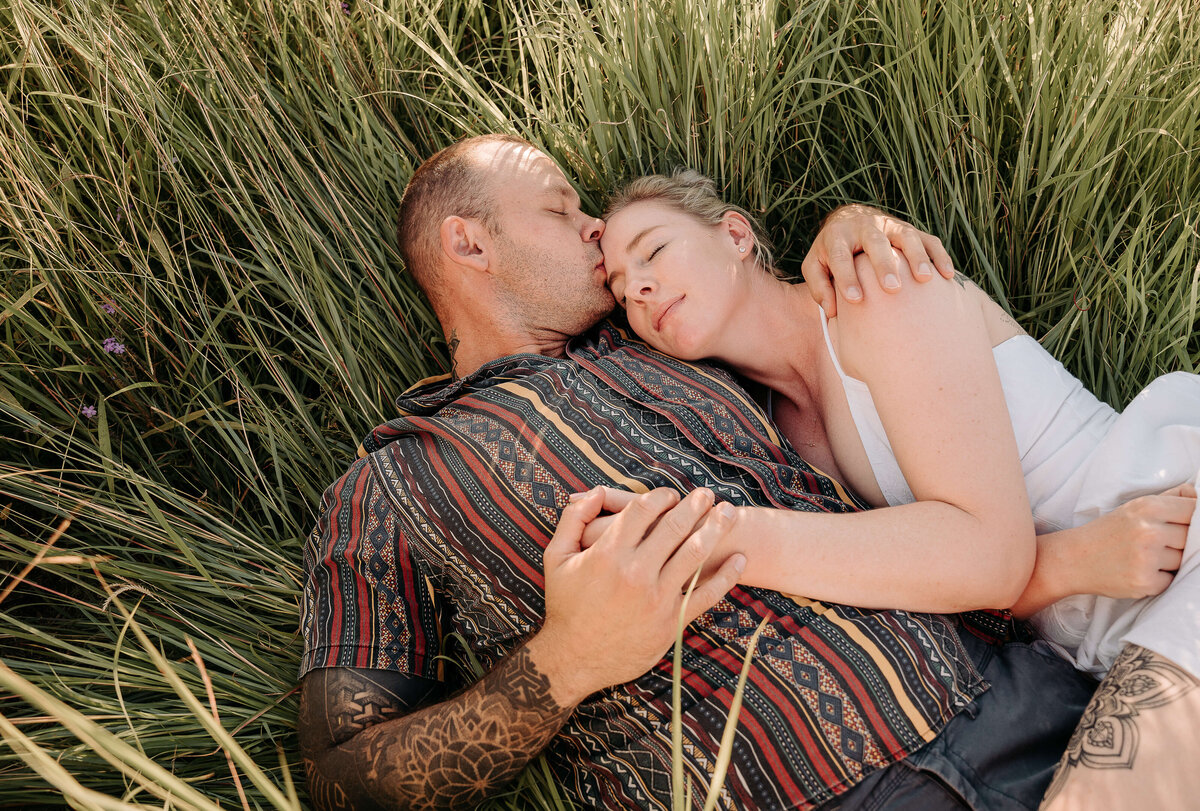 couple cuddling in high grass ipswich