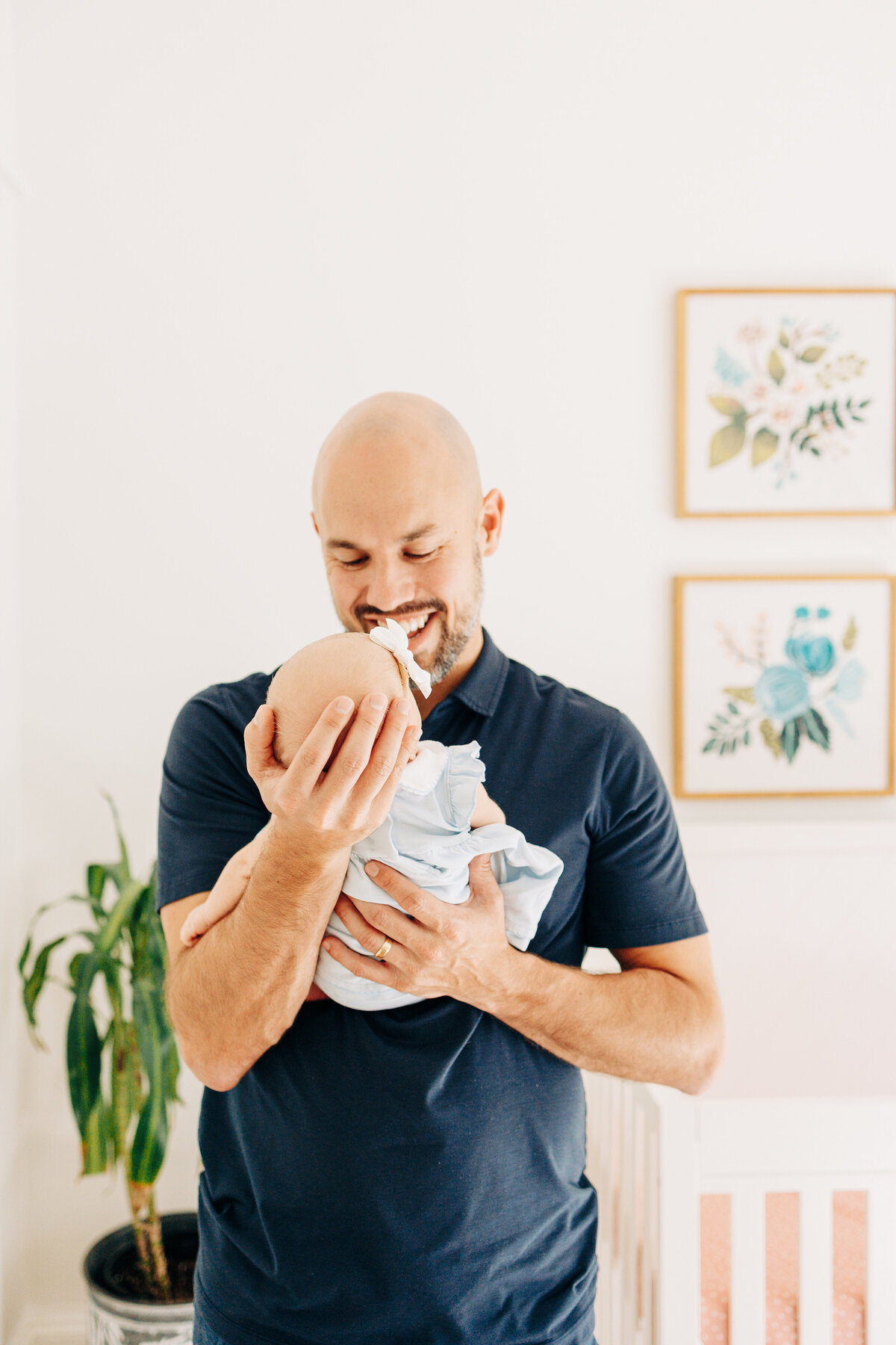 father and his newborn baby during a newborn session