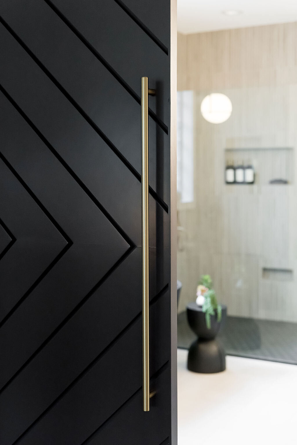dewine design interiors hotel lux sliding bathroom door with gold handle
