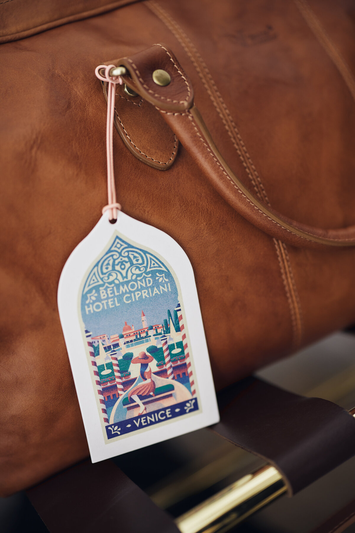 Luggage tag on brown bag from Belmond Hotel Cipriani Venice