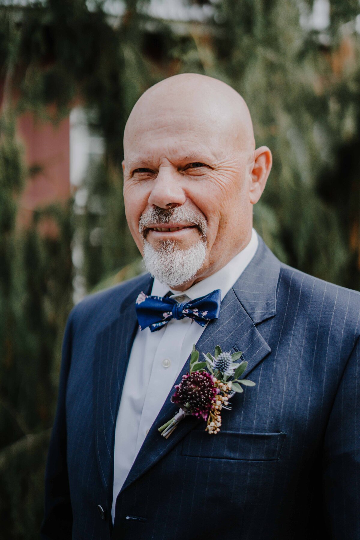 father of the groom posing for a portrait