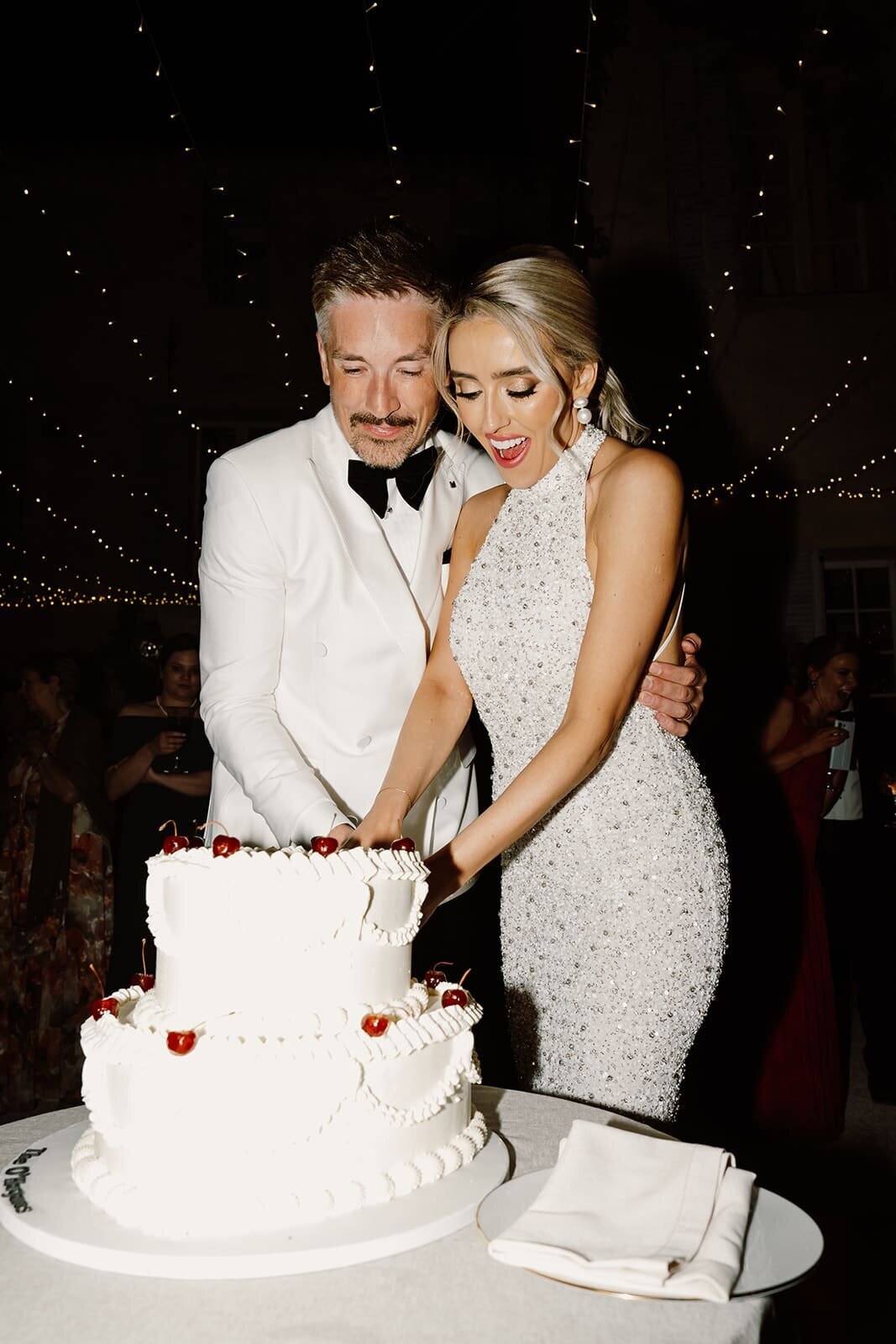 Bride-groom-cutting-heart-cake