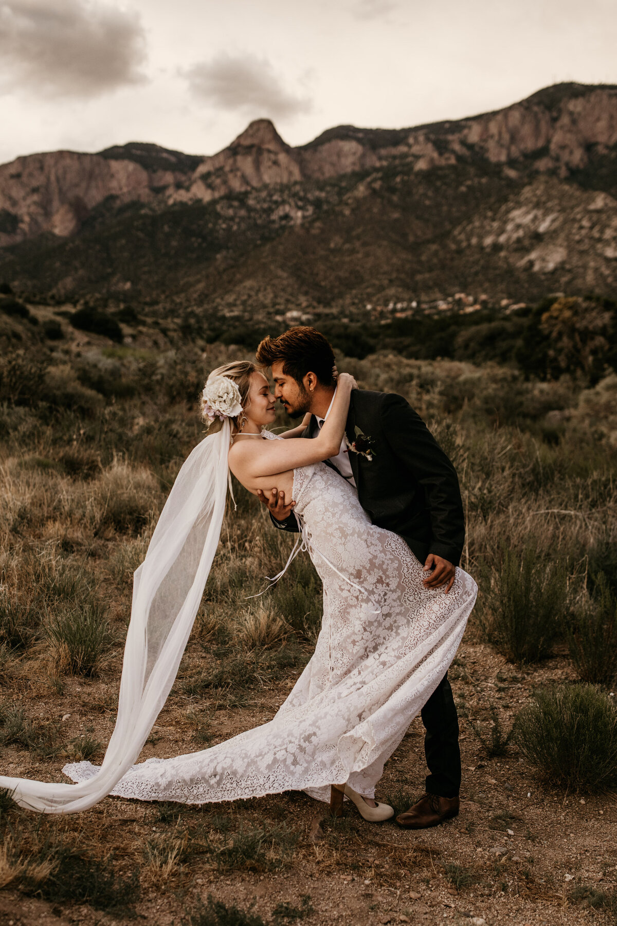 groom dipping bride in Albuquerque desert